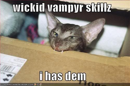 funny-pictures-vampire-cat-with-ski.jpg