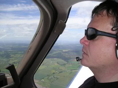 Peter at the controls over the Forest of Dean